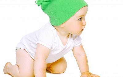 Among other things,  'winter babies' may be wearing less clothing in the summer,  when they are getting ready to crawl. (photo credit: Baby image)