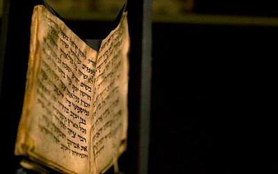 An ancient prayer book is seen on display at the Bible Lands museum in Jerusalem, Thursday, Sept. 18, 2014 (photo credit: AP/Sebastian Scheiner)