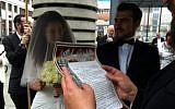 Igor and Elina, immigrants from the former Soviet Union, tie the knot in Potsdamer Platz (photo credit: JTA)
