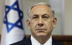 Prime Minister Benjamin Netanyahu attends a cabinet meeting in Jerusalem on October 7, 2014. (photo credit: AFP PHOTO / POOL /DAN BALILTY)