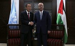 Palestinian prime minister Rami Hamdallah (R) shakes hands with UN Secretary-General Ban Ki-Moon following the latter's arrival in the West Bank city of Ramallah on October 13, 2014. (photo credit: AFP Photo/Ammar Awad)