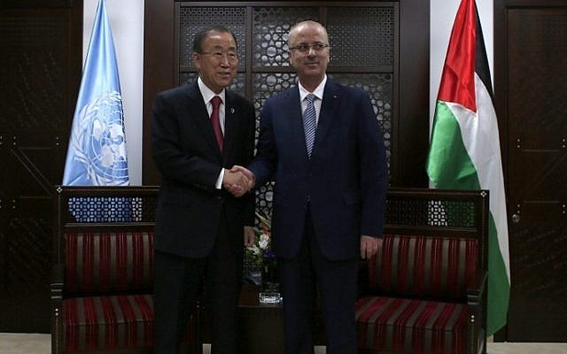 Palestinian prime minister Rami Hamdallah (R) shakes hands with UN Secretary-General Ban Ki-Moon following the latter's arrival in the West Bank city of Ramallah on October 13, 2014. (photo credit: AFP Photo/Ammar Awad) Palestinian prime minister Rami Hamdallah (R) shakes hands with UN Secretary-General Ban Ki-Moon following the latter's arrival in the West Bank city of Ramallah on October 13, 2014. (photo credit: AFP Photo/Ammar Awad)