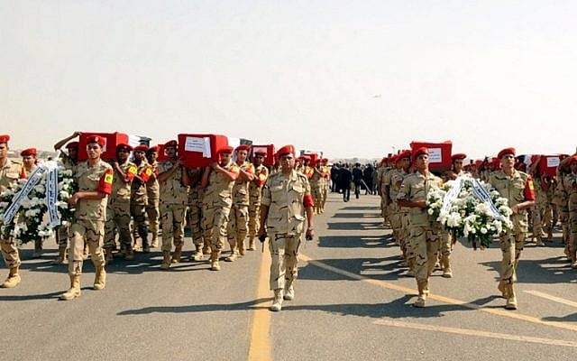 A handout picture released on October 25, 2014 by the Egyptian Presidency, shows the funeral for 30 solders killed the day before in the Sinai, at the Almaza military airbase in Cairo. (photo credit: AFP/ HO/EGYPTIAN PRESIDENCY) A handout picture released on October 25, 2014 by the Egyptian Presidency, shows the funeral for 30 solders killed the day before in the Sinai, at the Almaza military airbase in Cairo. (photo credit: AFP/ HO/EGYPTIAN PRESIDENCY)