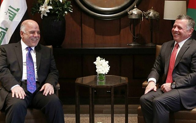 Iraqi Prime Minister Haider al-Abadi meets with King Abdullah II of Jordan (R) on October 26, 2014 at the royal palace in the capital Amman. (Khalil Mazraawi/AFP photo)