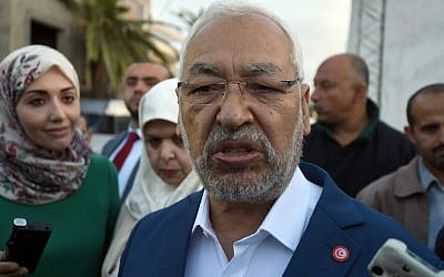 Tunisian Islamist Ennahda Party leader and founder, Rached Ghannouchi answers journalists' questions as he arrives to vote in the country's first post-revolution parliamentary election on October 26, 2014. (AFP/Fethi Belaid) Tunisian Islamist Ennahda Party leader and founder, Rached Ghannouchi answers journalists' questions as he arrives to vote in the country's first post-revolution parliamentary election on October 26, 2014. (AFP/Fethi Belaid)