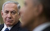 Prime Minister Benjamin Netanyahu looks on as US President Barack Obama speaks during a bilateral meeting at the White House in Washington, DC, October 1, 2014. (photo credit: AFP/Jim WATSON)