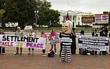 A protest against Israeli Prime Minister Benjamin Netanyahu's visit to the White House in Washington, DC, October 1, 2014. (photo credit: AFP/Jim WATSON)