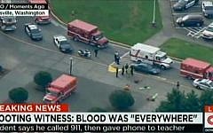 Police and ambulances at Marysville-Pilchuck High School in Marysville, Washington after a student opened fire inside the school before killing himself on October 24, 2014. (photo credit: AFP/HANDOUT-CNN/KOMO)