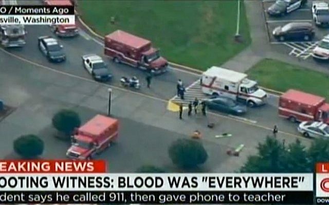 Police and ambulances at Marysville-Pilchuck High School in Marysville, Washington after a student opened fire inside the school before killing himself on October 24, 2014. (photo credit: AFP/HANDOUT-CNN/KOMO) Police and ambulances at Marysville-Pilchuck High School in Marysville, Washington after a student opened fire inside the school before killing himself on October 24, 2014. (photo credit: AFP/HANDOUT-CNN/KOMO)