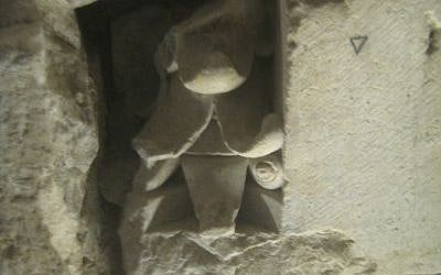 A Crusader capital integrated into the wall of a medieval inn, or khan, built in 1337 by the Mamluks, now beneath the Old City near the Temple Mount (photo credit: Ilan Ben Zion/Times of Israel) A Crusader capital integrated into the wall of a medieval inn, or khan, built in 1337 by the Mamluks, now beneath the Old City near the Temple Mount (photo credit: Ilan Ben Zion/Times of Israel)