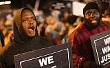 Demonstrators protest outside the Ferguson police department on October 10, 2014 in Ferguson, Missouri. (Scott Olson/Getty Images/AFP)