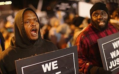 Demonstrators protest outside the Ferguson police department on October 10, 2014 in Ferguson, Missouri. (Scott Olson/Getty Images/AFP)