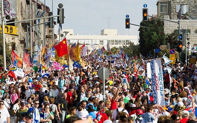 Feast of Tabernacle pilgrims march through the streets of Jerusalem. October 14, 2014. (Courtesy ICEJ)