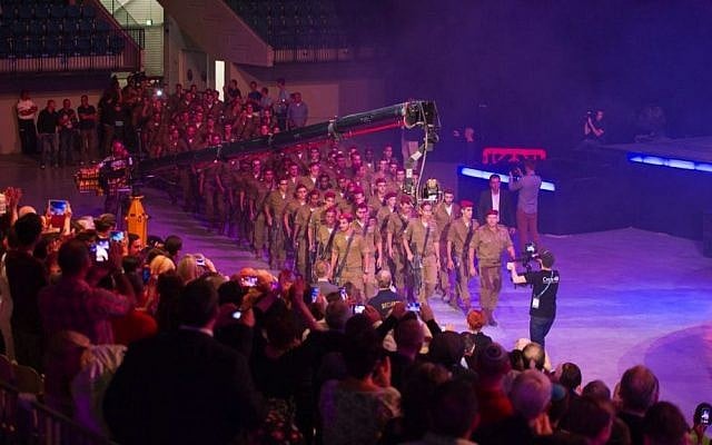 Audience members give standing ovation to IDF paratroopers as they march in to "Israeli Night" at the Feast of Tabernacles. October 14, 2014. (Courtesy ICEJ)