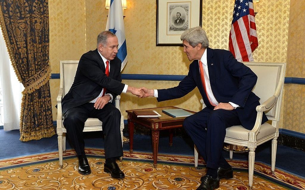 Benjamin Netanyahu, left, shaking hands with John Kerry in Washington in March 2014. (photo credit: US State Department)