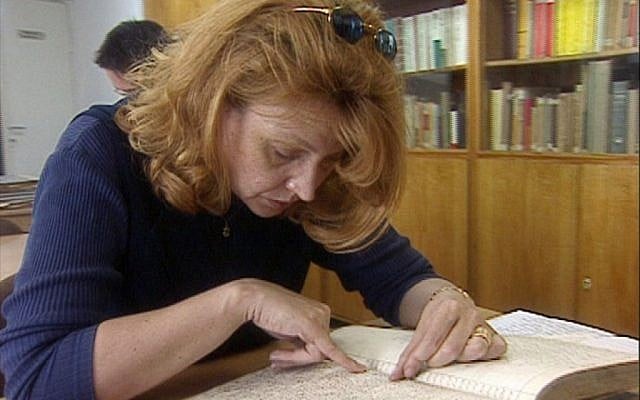 Malgorzata Lubinska searching archival records for her Jewish roots in "H-I-Jew Positive." (photo credit: Ron Katzenelson)
