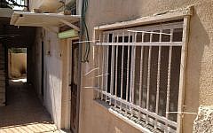 Wire netting covers one of the homes sold to Jews in Silwan, East Jerusalem, October 2, 2014 (photo credit: Elhanan Miller/Times of Israel)