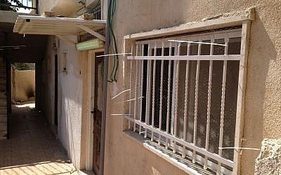 Wire netting covers one of the homes sold to Jews in Silwan, East Jerusalem, October 2, 2014 (photo credit: Elhanan Miller/Times of Israel)