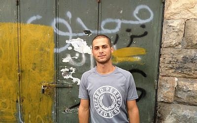 Muhammad Shehadeh outside his home in Silwan, October 2, 2014 (photo credit: Elhanan Miller/Times of Israel)