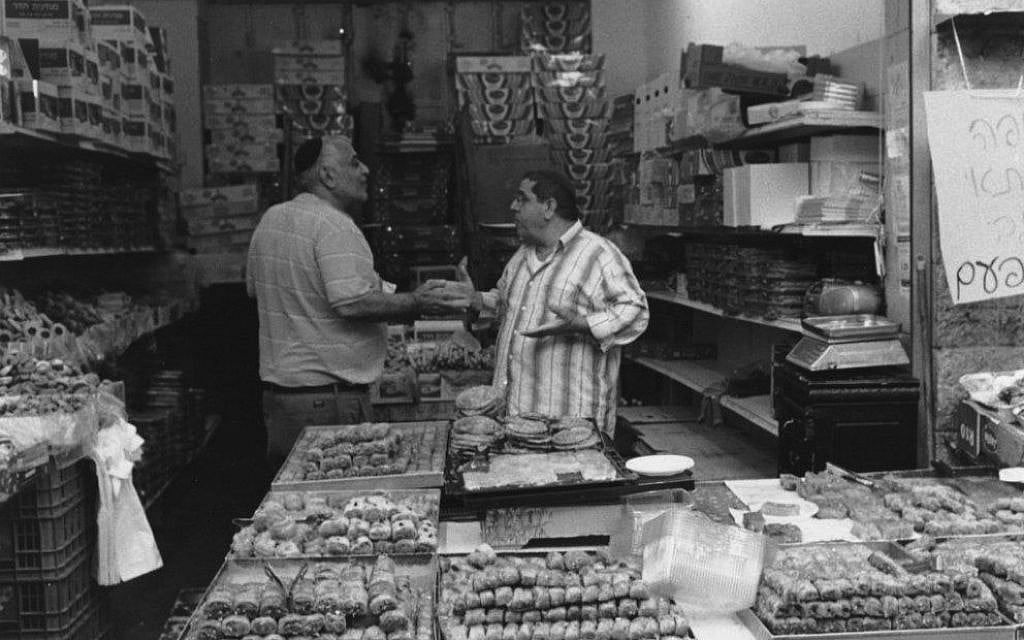 'Discussion in a pastry shop, Mahane Yehuda Market, Jerusalem' (photo credit: Paul Margolis)