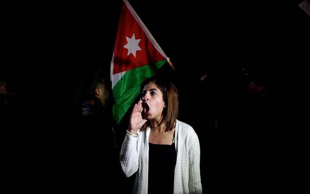 A Jordanian protester shouts slogans across the street from the Israeli embassy demanding the deportation of the Israeli ambassador after the killing of Jordanian judge Raed Zueter, 38, at Allenby crossing between Jordan and the West Bank, in Amman, Jordan, Monday, March 10, 2014 (photo credit: AP/Mohammad Hannon) A Jordanian protester shouts slogans across the street from the Israeli embassy demanding the deportation of the Israeli ambassador after the killing of Jordanian judge Raed Zueter, 38, at Allenby crossing between Jordan and the West Bank, in Amman, Jordan, Monday, March 10, 2014 (photo credit: AP/Mohammad Hannon)