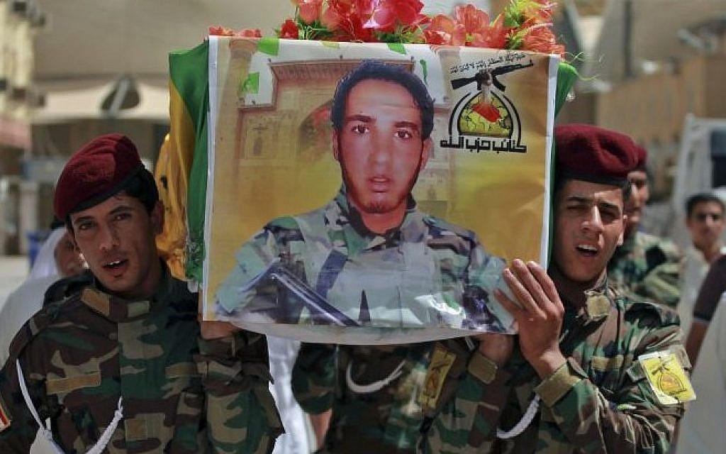 Iraqi Hezbollah fighters carry the coffin of a comrade killed in Mosul fighting Islamic militants, July 14, 2014 (Photo credit: Jaber al-Helo/AP)