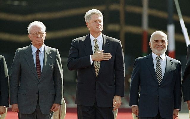 U.S. President Bill Clinton puts his hand on his heart, as he stands with Israeli Prime Minister Yitzhak Rabin, left, and Jordan's King Hussein while national anthems are played at the Israeli/Jordan peace signing ceremony at the Wadi Araba Israel/Jordan border crossing near Eilat in Israel on Wednesday, Oct. 26, 1994 (photo credit: AP/David Brauchli) U.S. President Bill Clinton puts his hand on his heart, as he stands with Israeli Prime Minister Yitzhak Rabin, left, and Jordan's King Hussein while national anthems are played at the Israeli/Jordan peace signing ceremony at the Wadi Araba Israel/Jordan border crossing near Eilat in Israel on Wednesday, Oct. 26, 1994 (photo credit: AP/David Brauchli)
