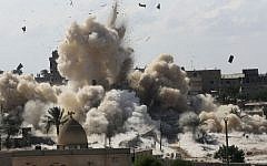 Smoke rises after Egyptian army demolished houses on the Egyptian side on border town of Rafah, Wednesday, Oct. 29, 2014. (Photo credit: AP/Eyad Baba)