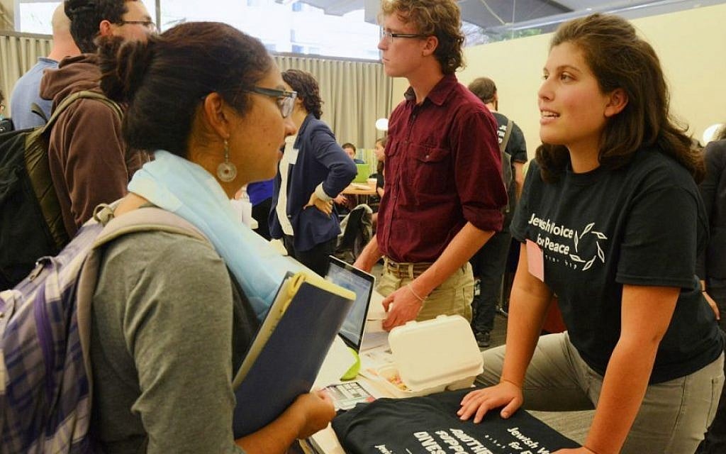 A representative of Jewish Voice for Peace speaking with a student at the Open Hillel conference at Harvard University, October 12, 2014. (Gili Getz/JTA) A representative of Jewish Voice for Peace speaking with a student at the Open Hillel conference at Harvard University, October 12, 2014. (Gili Getz/JTA)