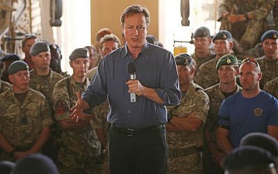 Britain's Prime Minister David Cameron addresses British troops, in Camp Bastion, Afghanistan, Friday, Oct. 3, 2014. (photo credit: AP Photo/Dan Kitwood, Pool)