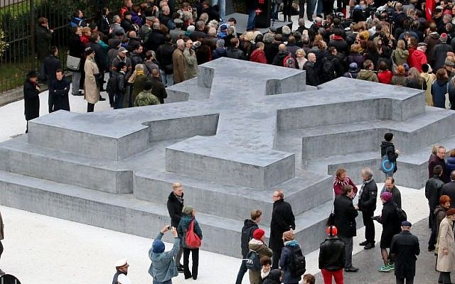 People surround a memorial dedicated to deserters of the Nazi Wehrmacht troops and victims of their military justice during its unveiling ceremony in downtown Vienna, Austria, Friday, October 24, 2014 (Photo credit: Ronald Zak/AP) People surround a memorial dedicated to deserters of the Nazi Wehrmacht troops and victims of their military justice during its unveiling ceremony in downtown Vienna, Austria, Friday, October 24, 2014 (Photo credit: Ronald Zak/AP)