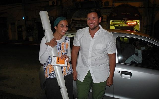 Tanya and Josh Saunders make a late night lulav and etrog delivery about an hour before my flight. Usually you can't even get a pizza this quickly! (Melanie Lidman/Times of Israel)