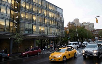 Cars pass Manhattan's Bellevue Hospital where Craig Spencer, a Doctors Without Borders physician who recently returned to the city after treating Ebola patients in West Africa, was rushed to Thursday, Oct. 23, 2014, in New York. (AP Photo/John Minchillo)