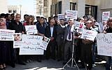 Palestinian journalists gather in front of the Interior Ministry in the West Bank city of Ramallah on August 25, 2013, following an incident during which PA officers beat a number of journalists during a rally in Ramallah last Friday. (photo credit: Issam Rimawi/Flash90)