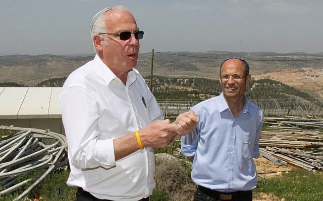 David Perl, right, with housing and construction minister Uri Ariel during a visit to Gush Etzion,  April 1, 2014 photo credit: Gershon Elinson/Flash90)