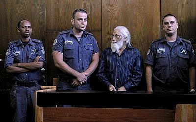 Goel Ratzon, second from right, attends his verdict in the district court room in Tel Aviv on Monday, September 8, 2014. (Photo credit: Dror Einav/Pool/Flash90)