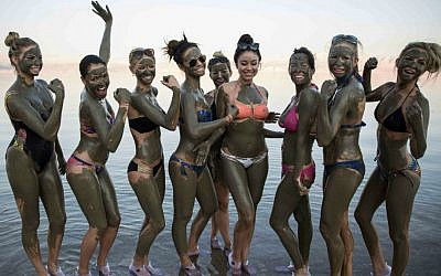 Eleven beauty queens at the Dead Sea, part of a Faces of Israel tour of the land (photo credit: Hadas Parush/Flash90)
