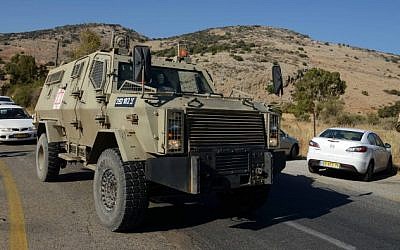 An Israeli vehicle at the scene where two soldiers were wounded in a bomb explosion near the border with Lebanon, October 7, 2014 (photo credit: Flash90)