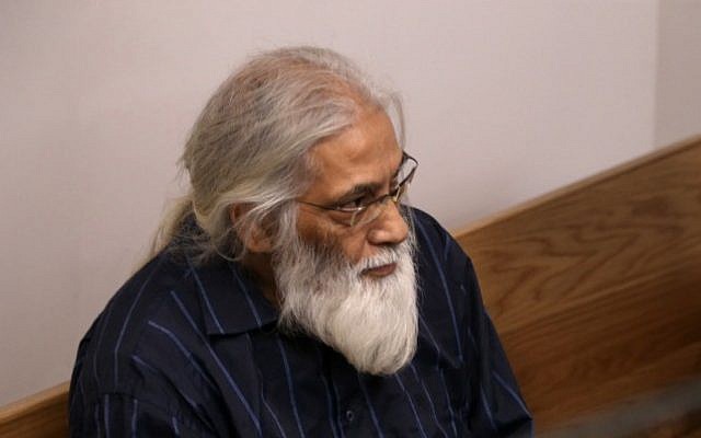 Goel Ratzon, a polygamist cult leader, seen in the Tel Aviv District Court , October 22, 2014. (photo credit: Flash90) Goel Ratzon, a polygamist cult leader, seen in the Tel Aviv District Court , October 22, 2014. (photo credit: Flash90)