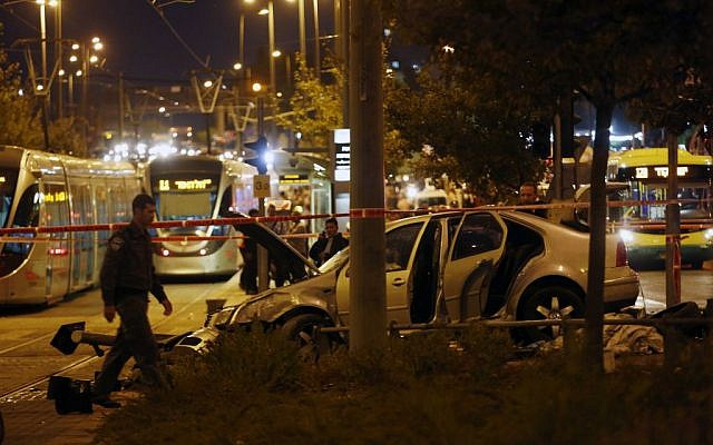 Police and rescue personnel at the scene where several people were injured when a car crashed into the Jerusalem light rail station on October 22, 2014. (Photo credit: Yonatan Sindel/Flash90) Police and rescue personnel at the scene where several people were injured when a car crashed into the Jerusalem light rail station on October 22, 2014. (Photo credit: Yonatan Sindel/Flash90)
