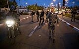 Police and rescue personnel at the scene of a terror attack that killed one baby and injured several pedestrians when a car crashed into a Jerusalem light rail station. (photo credit: Yonatan Sindel/Flash90)