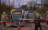 Police and rescue personnel at the scene where several people were injured when a car crashed into a Jerusalem Light Rail station, on October 22, 2014. (photo credit: Yonatan Sindel/Flash90)