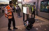 Police and rescue personnel at the scene where several people were injured after a Palestinian crashed a car into a Jerusalem light rail station, October 22, 2014. (photo credit: Yonatan Sindel/Flash90)