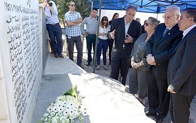 President Reuven Rivlin second from right) at a memorial ceremony October 26, 2014, to mark the 58th anniversary of the Kafr Kassem massacre, during which Israeli border police shot to death 49 Arab Israelis. (Photo credit: Mark Neyman/GPO) President Reuven Rivlin second from right) at a memorial ceremony October 26, 2014, to mark the 58th anniversary of the Kafr Kassem massacre, during which Israeli border police shot to death 49 Arab Israelis. (Photo credit: Mark Neyman/GPO)
