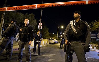 Israeli Police block off scene of shooting outside Jerusalem's Begin Heritage Center, where the leader of the Temple Mount Faithful was seriously injured on October 29, 2014. (photo credit: Yonatan Sindel/Flash90) 