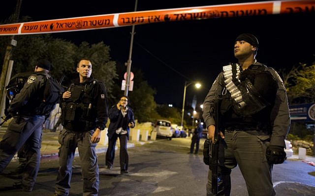 Israeli Police block off scene of shooting outside Jerusalem's Begin Heritage Center, where the leader of the Temple Mount Faithful was seriously injured on October 29, 2014. (photo credit: Yonatan Sindel/Flash90) Israeli Police block off scene of shooting outside Jerusalem's Begin Heritage Center, where the leader of the Temple Mount Faithful was seriously injured on October 29, 2014. (photo credit: Yonatan Sindel/Flash90)