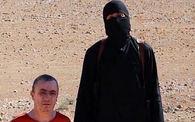 A frame from a video released Friday, Oct. 3, 2014, by Islamic State terrorists that shows the killing of British aid worker Alan Henning (photo credit: AP Photo)