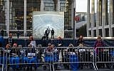 People, some in wheelchairs, gather at Lincoln Center, with the Metropolitan Opera House in the background, as they protest 'Death of Klinghoffer' Monday, Oct 20, 2014, in New York. (Photo credit: AP/Craig Ruttle)