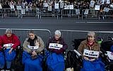People, some in wheelchairs, gather at Lincoln Center as they protest "Death of Klinghoffer" Monday, Oct 20, 2014, in New York. (Photo credit: AP/Craig Ruttle)
