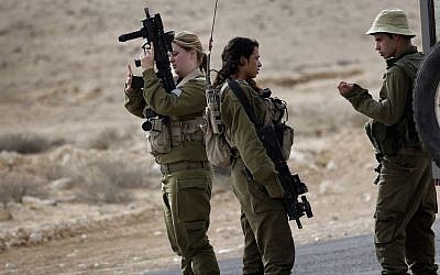 Israeli soldiers stand near the Israel and Egypt border on Wednesday, October 22, 2014. (photo credit: AP/Tsafrir Abayov)